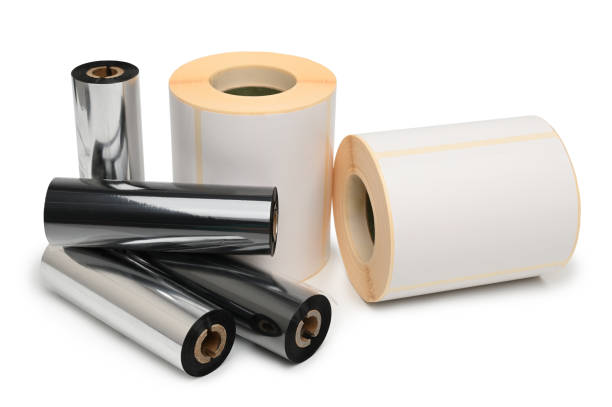 Rroll wax ribbon for thermal transfer printer in core and thermal labels on white background